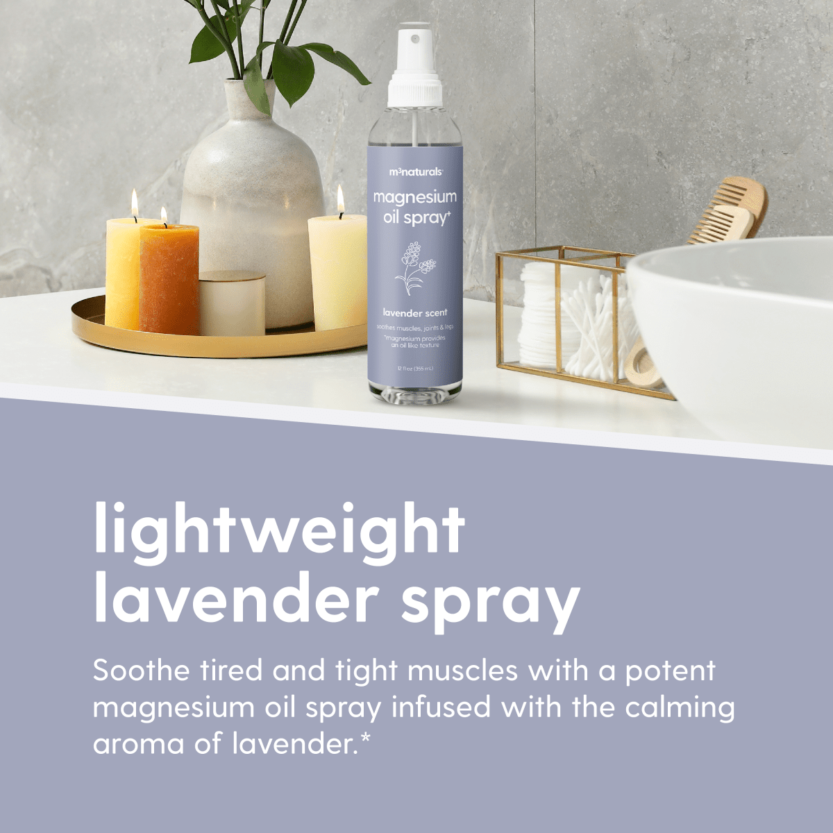 Bottle of magnesium oil spray with candles and a bowl on a countertop.