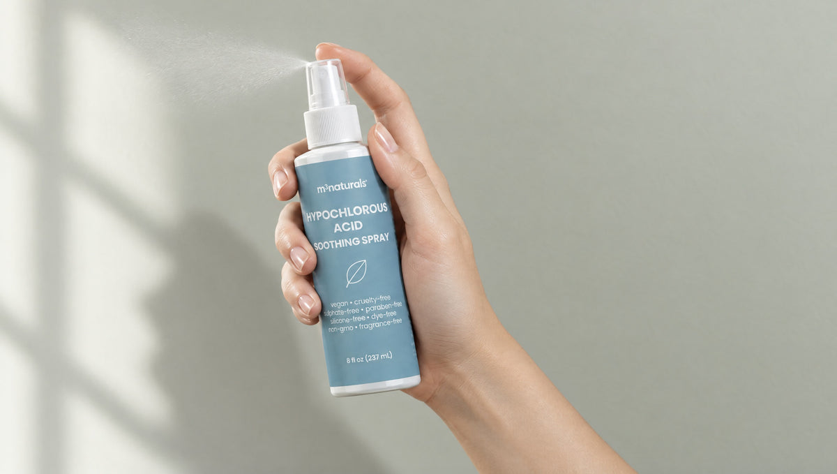 Hand holding M3 Naturals Hypochlorous Acid Soothing Spray, misting